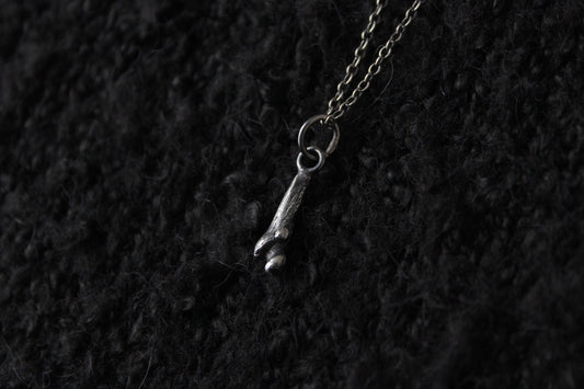 Tiny Silver Ossuary Bone Pendant