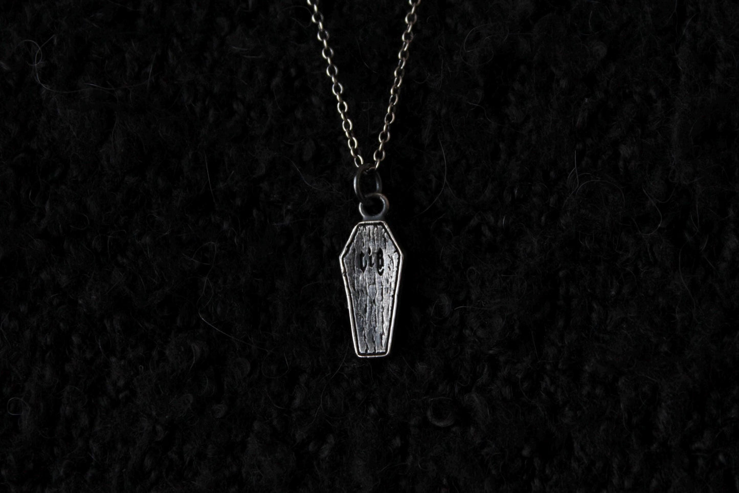 The Clad in Black Silver Casket Pendant